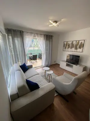 a living room with a couch and a tv at Sea view and pool! Brend new! Vista in Kotor
