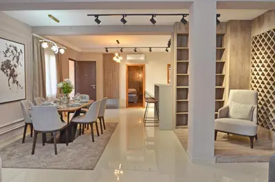 a dining room and living room with a table and chairs at Boka Devine Residence in Kotor