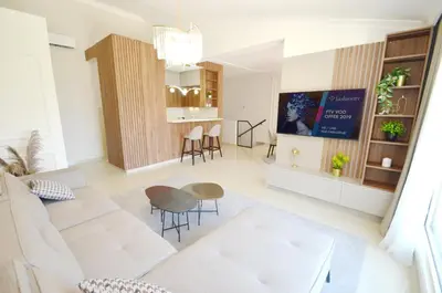 a living room with a white couch and a tv at Boka Devine Residence in Kotor