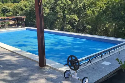a swimming pool next to a house with aoked at Villa Hedonic in Ulcinj