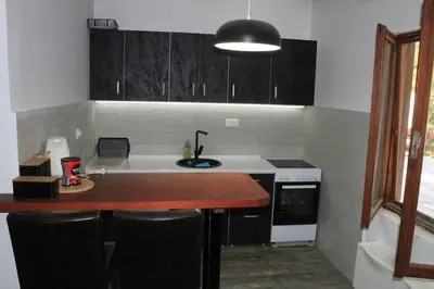 a kitchen with a sink and a counter top at Villa Hedonic in Ulcinj