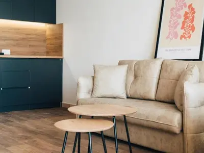 a living room with a couch and two tables at Hayal Boutique Hotel in Bar