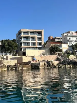 a large body of water with buildings in the background at Hayal Boutique Hotel in Bar