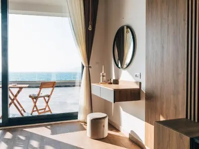 a bathroom with a sink and a mirror and a window at Hayal Boutique Hotel in Bar