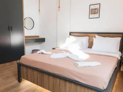 a bedroom with a bed with two towels on it at Hayal Boutique Hotel in Bar