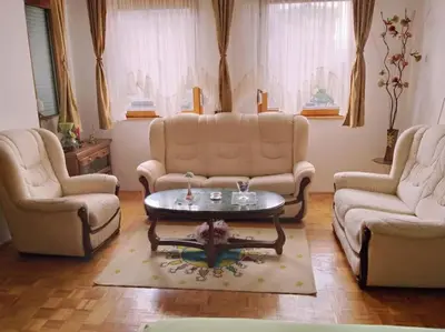 a living room with three couches and a coffee table at Apartment in Podgorica - Montenegro in Konik