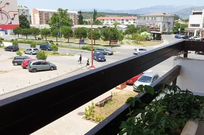 a view of a parking lot with cars parked at Apartment in Podgorica - Montenegro in Konik