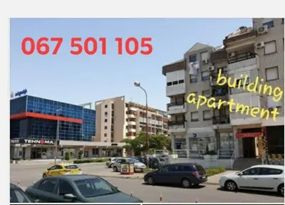 a picture of a city with cars parked in a parking lot at Apartment in Podgorica - Montenegro in Konik