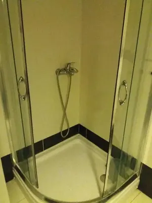 a shower with a glass door in a bathroom at Sofia apartment in Budva