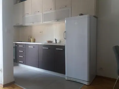 a kitchen with a white refrigerator in a room at Sofia apartment in Budva