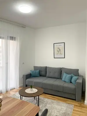 a living room with a couch and a table at Le Vacanze 2 in Ulcinj