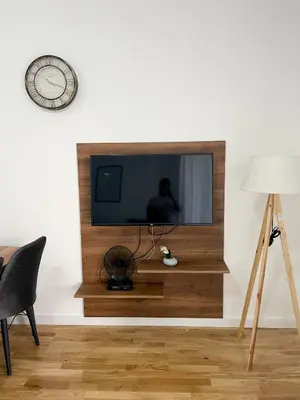 a living room with a television on a wall at Le Vacanze 2 in Ulcinj