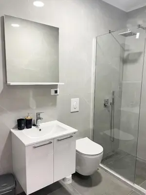 a bathroom with a toilet and a sink and a shower at Le Vacanze 2 in Ulcinj