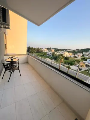 a balcony with a table and a view of a city at Le Vacanze 2 in Ulcinj