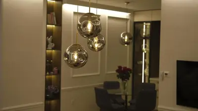 a dining room with a table and three lights at Sunshine of Montenegro - Luxury in Kotor