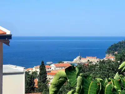 a view of the ocean from a city at Summer Apartment Petrovac in Petrovac na Moru