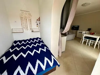 a living room with a blue and white rug on the floor at Summer Apartment Petrovac in Petrovac na Moru