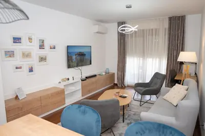 a living room with a couch and chairs at Apartment Minna Master Quart in Podgorica