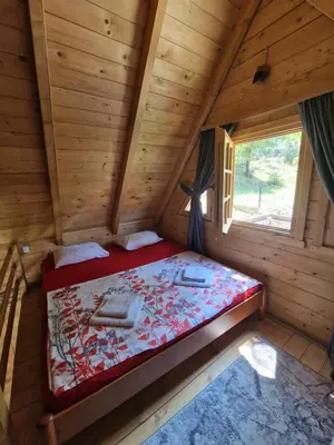 an overhead view of a bed in a log cabin at Brvnara RIĆKI in Cetinje