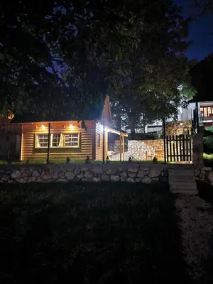 a house lit up at night with lights at Brvnara RIĆKI in Cetinje