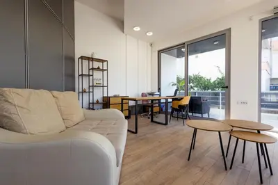 a living room with a couch and a table at Apartments RONDO in Ulcinj