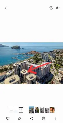 a view of a city with the ocean in the background at Apartman Ema in Budva