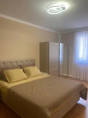a bedroom with a large bed in a room at Two bedroom lux apartment in Budva