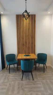 a dining room with a table and two chairs at Apartmani Kralj in Bar