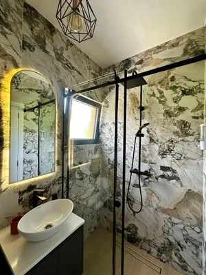 a bathroom with a sink and a shower at Adriatic Dream in Tivat