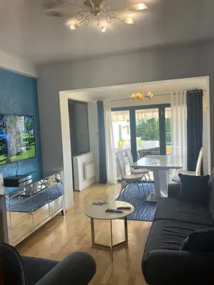 a living room with a couch and a table at Stan apartman Nikola in Budva