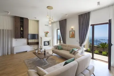 a living room with a couch and a table at Luxury Villa Flower in Budva