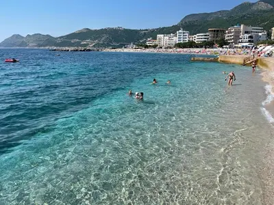 a group of people in the water at a beach at Villa Sunshine in Bar