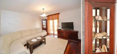 a living room with a couch and a television at Apartment Nikolija in Dobrota