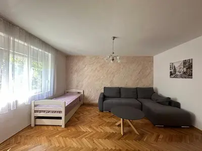 a living room with a couch and a bed at Heart of the City in Budva