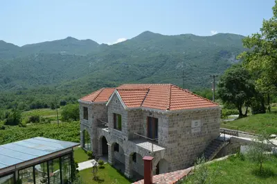 a house with a view of the mountains at Markovic Winery and Estate apartments in Cetinje
