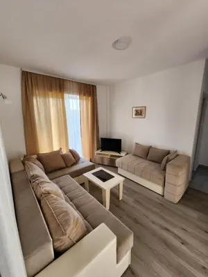 a living room with a couch and a table at Apartment FLORA in Bregvija