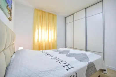 a bedroom with a bed with the word comfort on it at LUX Apartment TEAM JOKIC in Becici