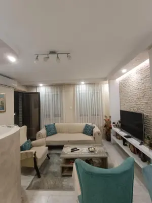 a living room with a couch and a tv at Nikolaj in Podgorica