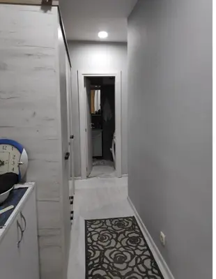 a hallway with a hallway leading to a bathroom at Nikolaj in Podgorica