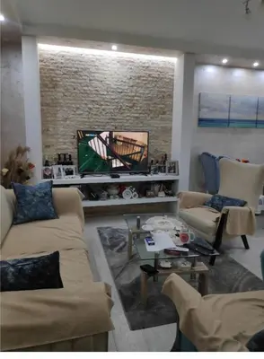 a living room with two couches and a tv at Nikolaj in Podgorica