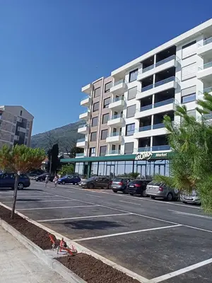 a parking lot in front of a large building at OLIVA apartment BAR in Bar