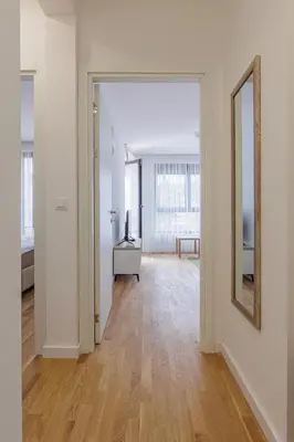 an empty room with a hallway with a mirror at OLIVA apartment BAR in Bar