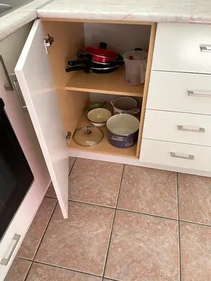 a kitchen cabinet with bowls and pans in it at Amonte in Budva