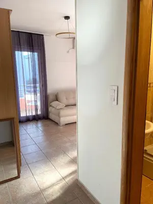 a living room with a couch and a window at Amonte in Budva