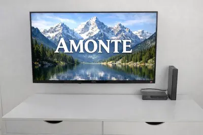 a flat screen tv sitting on top of a white table at Amonte in Budva