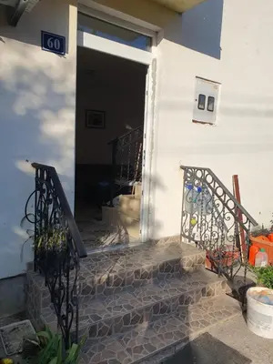 an open door of a house with a staircase at Villa Blanca in Bar