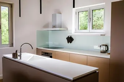 a kitchen with a sink and a counter top at Penthouse TivatHeights Pool & Sea View-B4 in Kavač
