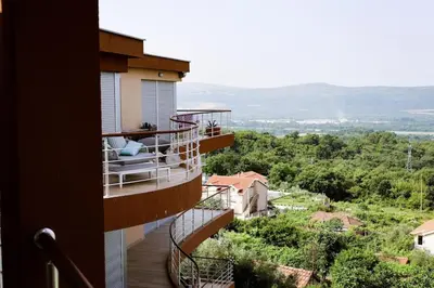 a balcony of a building with a view of the countryside at Penthouse TivatHeights Pool & Sea View-B4 in Kavač