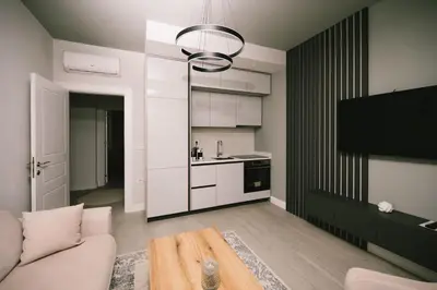 a living room with a couch and a table at Apartments Moon White Lux in Ulcinj