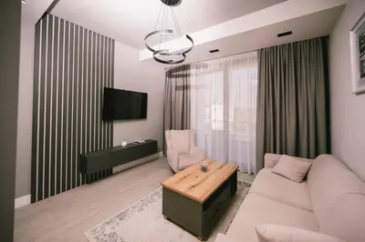 a living room with a couch and a table at Apartments Moon White Lux in Ulcinj